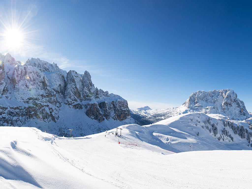 Ski area Selva di Val Gardena - Dantecepies ski slope with Sella Group, Sassolungo in winter