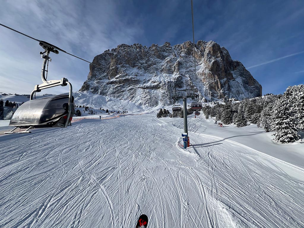 Ski slope and chairlift Sostsaslong at the foot of the Sassolungo in Val Gardena - Dolomiti Superski